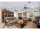 Spacious living area with comfortable seating and large windows at 11193 Baltimore St, Weeki Wachee, FL 34614