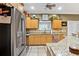 Bright kitchen featuring stainless steel appliances and ample cabinetry at 11193 Baltimore St, Weeki Wachee, FL 34614
