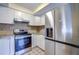Stainless steel appliances and granite countertops in this updated kitchen at 2727 Featherstone Dr # 2727, Holiday, FL 34691