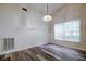 Bright dining room with hardwood floors and a chandelier at 2727 Featherstone Dr # 2727, Holiday, FL 34691