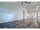 Open living room with hardwood floors at 2727 Featherstone Dr # 2727, Holiday, FL 34691