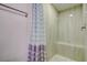 Walk-in shower with tiled walls and built-in seat at 2727 Featherstone Dr # 2727, Holiday, FL 34691