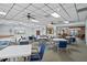 Bright community room with tables and chairs at 4632 Marine Pkwy # 302, New Port Richey, FL 34652