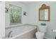 Bathroom with a shower, toilet and bathtub at 7413 Gettysburg Dr, Weeki Wachee, FL 34607
