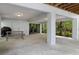 Covered patio with picnic table, wooded views, and plenty of space for outdoor entertaining at 7413 Gettysburg Dr, Weeki Wachee, FL 34607