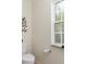 Clean bathroom with toilet and window at 7413 Gettysburg Dr, Weeki Wachee, FL 34607