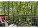 Deck with chairs and wooded views, perfect for enjoying the outdoors at 7413 Gettysburg Dr, Weeki Wachee, FL 34607
