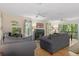 Cozy living room featuring fireplace, hardwood floors, and comfy seating at 7413 Gettysburg Dr, Weeki Wachee, FL 34607