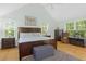 Spacious main bedroom with king bed, ample natural light, and wood floors at 7413 Gettysburg Dr, Weeki Wachee, FL 34607