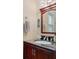 Clean bathroom with vanity, sink, and decorative accents at 7413 Gettysburg Dr, Weeki Wachee, FL 34607