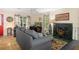 Living room with fireplace, hardwood floors, and access to deck at 7413 Gettysburg Dr, Weeki Wachee, FL 34607