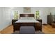 Spacious main bedroom with king-size bed and large windows at 7413 Gettysburg Dr, Weeki Wachee, FL 34607