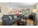 Bright and airy living room with hardwood floors and neutral decor at 7413 Gettysburg Dr, Weeki Wachee, FL 34607