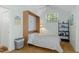 Charming bedroom with a full-size bed and wood floors at 7413 Gettysburg Dr, Weeki Wachee, FL 34607