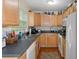Well-equipped kitchen featuring light wood cabinets and modern appliances at 7413 Gettysburg Dr, Weeki Wachee, FL 34607