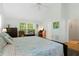 Spacious primary bedroom with king-size bed and wood floors at 7413 Gettysburg Dr, Weeki Wachee, FL 34607
