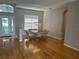 Spacious dining area with hardwood floors and a modern chandelier at 402 Knight Dr, Tarpon Springs, FL 34688