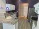 Kitchen with granite countertops, stainless steel appliances, and white cabinets at 402 Knight Dr, Tarpon Springs, FL 34688