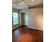 Bedroom with hardwood floors and a walk-in closet at 402 Knight Dr, Tarpon Springs, FL 34688