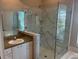 Bathroom with walk-in shower and updated vanity at 402 Knight Dr, Tarpon Springs, FL 34688