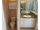 Small bathroom with toilet and vanity at 402 Knight Dr, Tarpon Springs, FL 34688