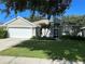 Single-story house with attached garage at 402 Knight Dr, Tarpon Springs, FL 34688