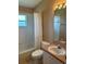 Small bathroom with tub, toilet, and vanity at 402 Knight Dr, Tarpon Springs, FL 34688