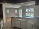 Open kitchen with granite countertops and a view of the pool at 402 Knight Dr, Tarpon Springs, FL 34688