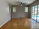 Spacious living room featuring hardwood floors and a ceiling fan at 402 Knight Dr, Tarpon Springs, FL 34688