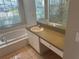 Bathroom features a vanity with drawers and a large mirror at 402 Knight Dr, Tarpon Springs, FL 34688