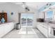 Bright kitchen with white cabinets and water views at 6412 Yvette Dr, Hudson, FL 34667