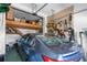 Garage with a loft for extra storage and pegboard wall at 6412 Yvette Dr, Hudson, FL 34667