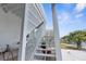 White wooden stairs leading to a waterfront home with lattice details at 6412 Yvette Dr, Hudson, FL 34667