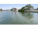Calm waterway view showcasing neighboring waterfront homes at 6412 Yvette Dr, Hudson, FL 34667