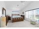 Spacious bedroom with water views and wood furniture at 6412 Yvette Dr, Hudson, FL 34667