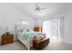 Bright bedroom with white bed frame and water views at 6412 Yvette Dr, Hudson, FL 34667