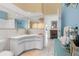 Bathroom with a corner vanity and blue accents at 6412 Yvette Dr, Hudson, FL 34667