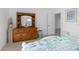 Bedroom with wood dresser and built in shelving at 6412 Yvette Dr, Hudson, FL 34667