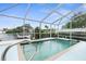 Inviting screened pool with canal views at 6412 Yvette Dr, Hudson, FL 34667