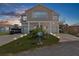 Two-story waterfront home with a boat and landscaped yard at 6412 Yvette Dr, Hudson, FL 34667