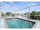 Inviting screened pool with water views at 6412 Yvette Dr, Hudson, FL 34667