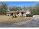 Brick ranch house with a garage and picnic table at 4148 Batten Rd, Brooksville, FL 34602