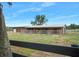 Modern barn with multiple stalls and a fenced area at 4148 Batten Rd, Brooksville, FL 34602