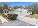 Ranch home with attached garage and manicured landscaping at 4148 Batten Rd, Brooksville, FL 34602