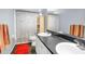 Bathroom with double sinks, shower/tub combo, and tile floor at 4148 Batten Rd, Brooksville, FL 34602