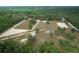 Aerial view of expansive equestrian property with arenas, paddocks, and a barn at 4148 Batten Rd, Brooksville, FL 34602