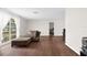Living room with wood-look floors and large windows at 4148 Batten Rd, Brooksville, FL 34602