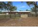 Spacious barn with multiple stalls and attached garage at 4148 Batten Rd, Brooksville, FL 34602