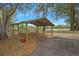 Open-air covered parking structure with wood frame at 4148 Batten Rd, Brooksville, FL 34602