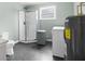 Basement bathroom with shower, toilet, and laundry hookups at 4148 Batten Rd, Brooksville, FL 34602